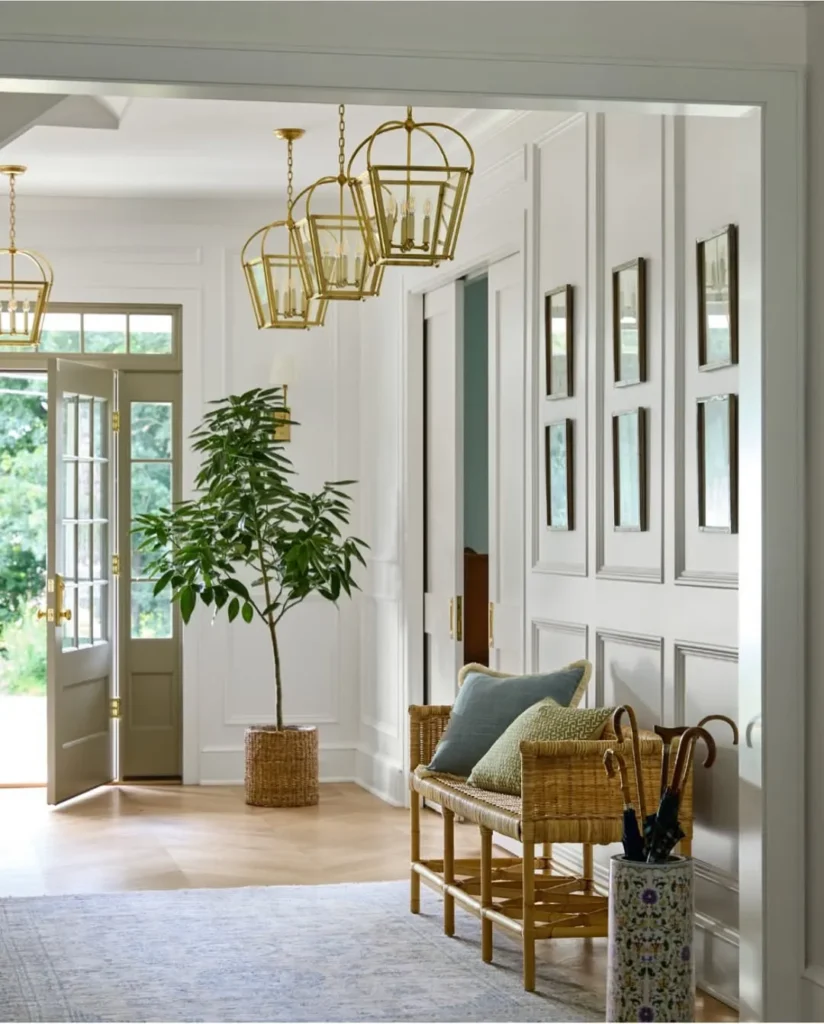 Elegant Hallway with Woven Seating and Brass Lanterns