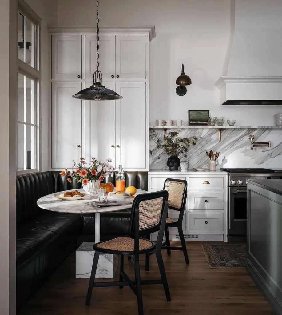 Black Leather Banquette with Cane Chairs and Marble