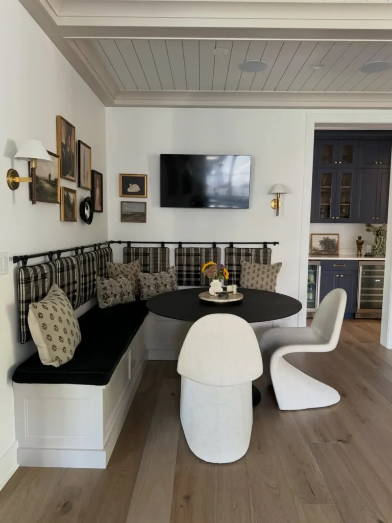 Black and White Corner Banquette with Plaid Cushions