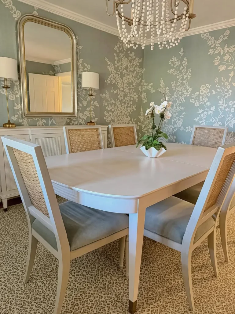 Blue Botanical Wallpaper With Cane-Back Chairs