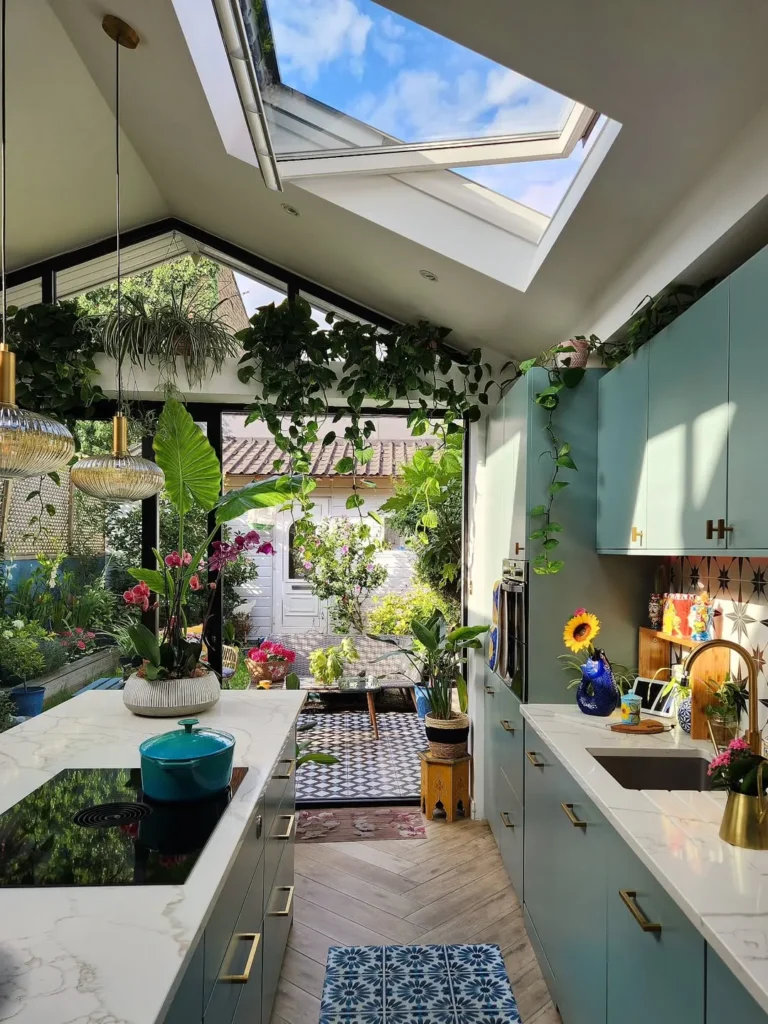 Blue-Green Solarium Kitchen With Open Garden View