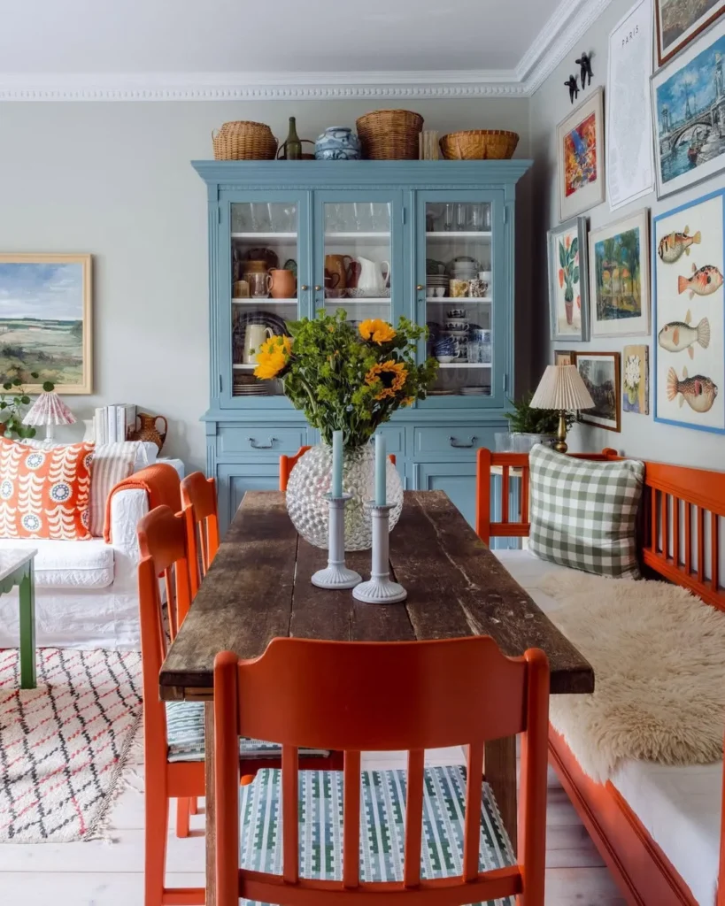 Blue Hutch Dining Room With Orange Chairs