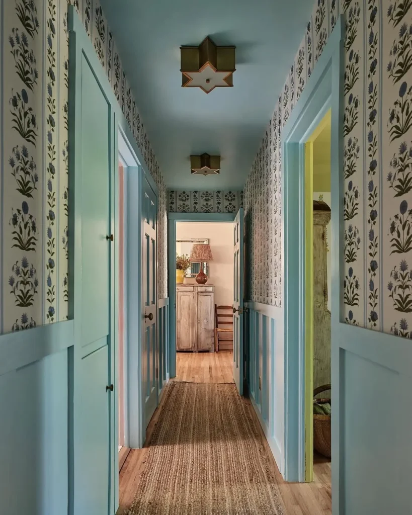 Blue Trim Narrow Entrance Hall with Floral Wallpaper