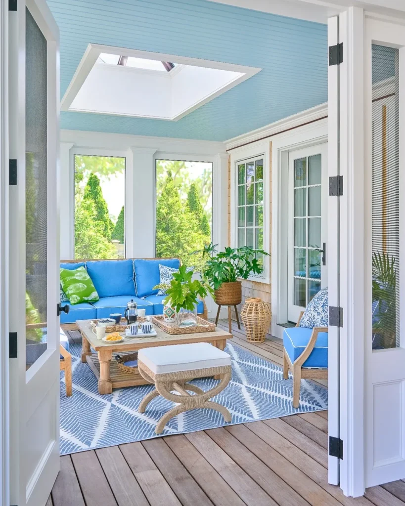 Bright Blue Screened Porch with Skylight and Casual Seating