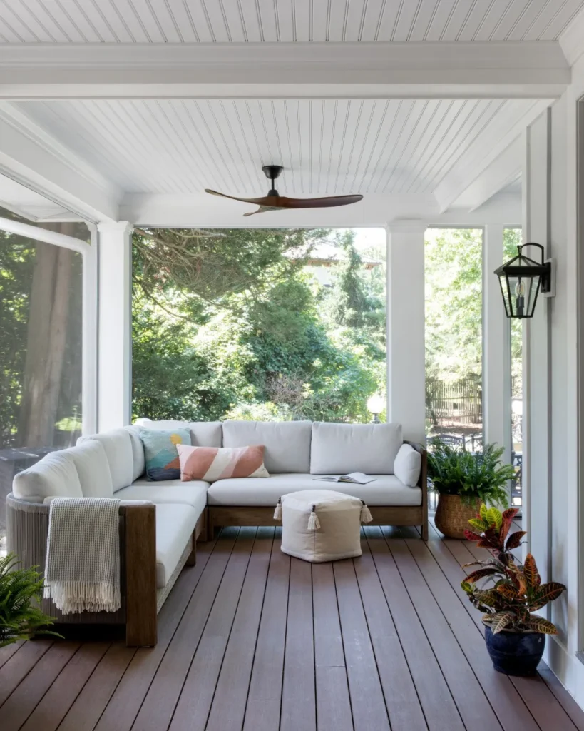 Bright White Screened Porch with Corner Sofa