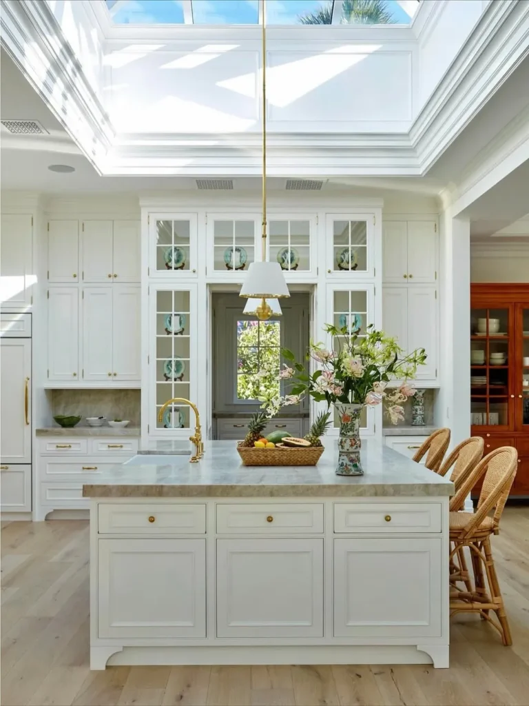 Bright White Solarium Kitchen With Cane Stools