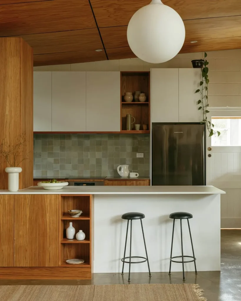 Clean Line Kitchen with White Breakfast Bar and Wood Cabinets