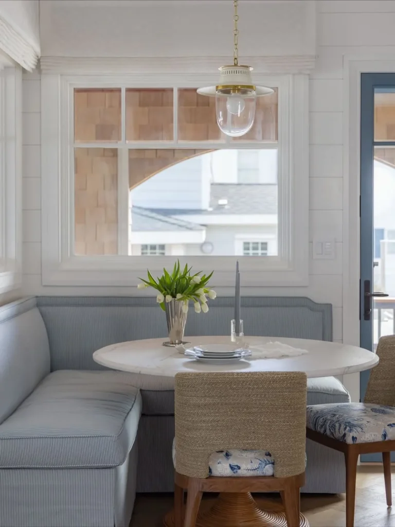 Coastal Banquette Corner with a Round Marble Table