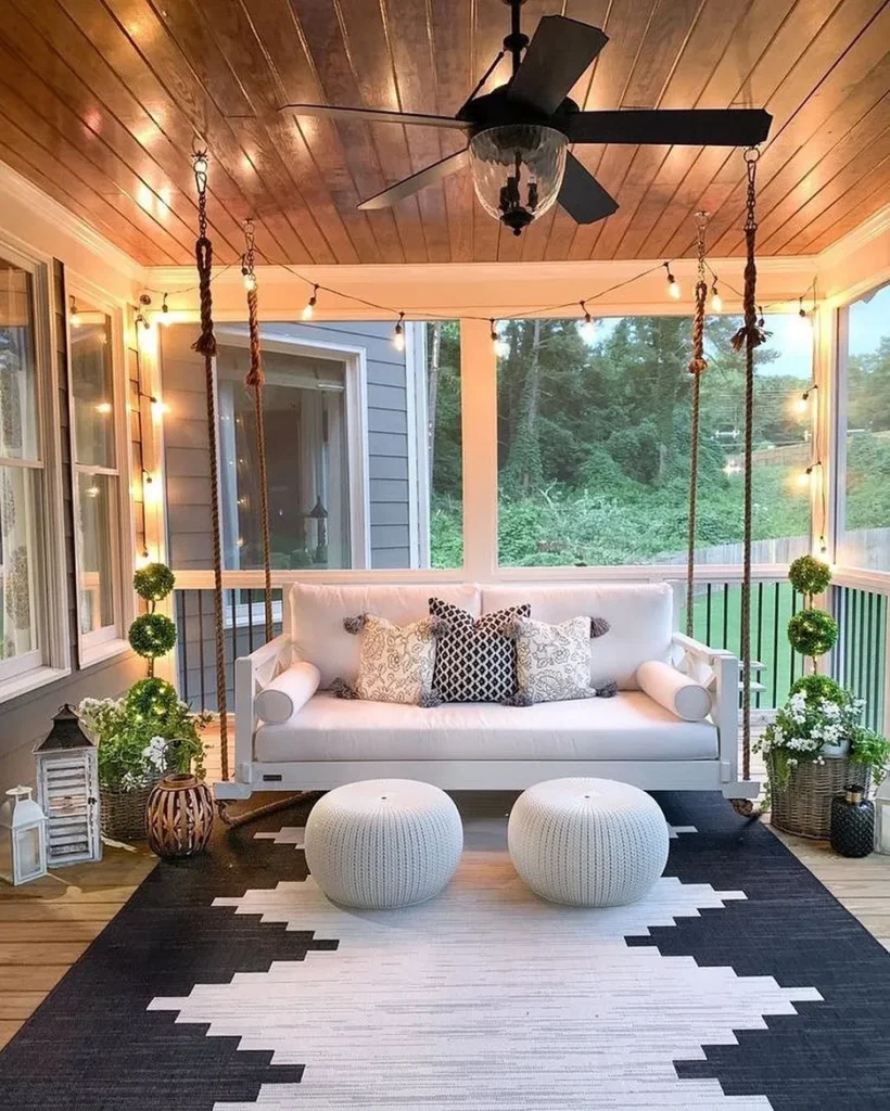Cozy Screened Porch with Hanging Swing Seat