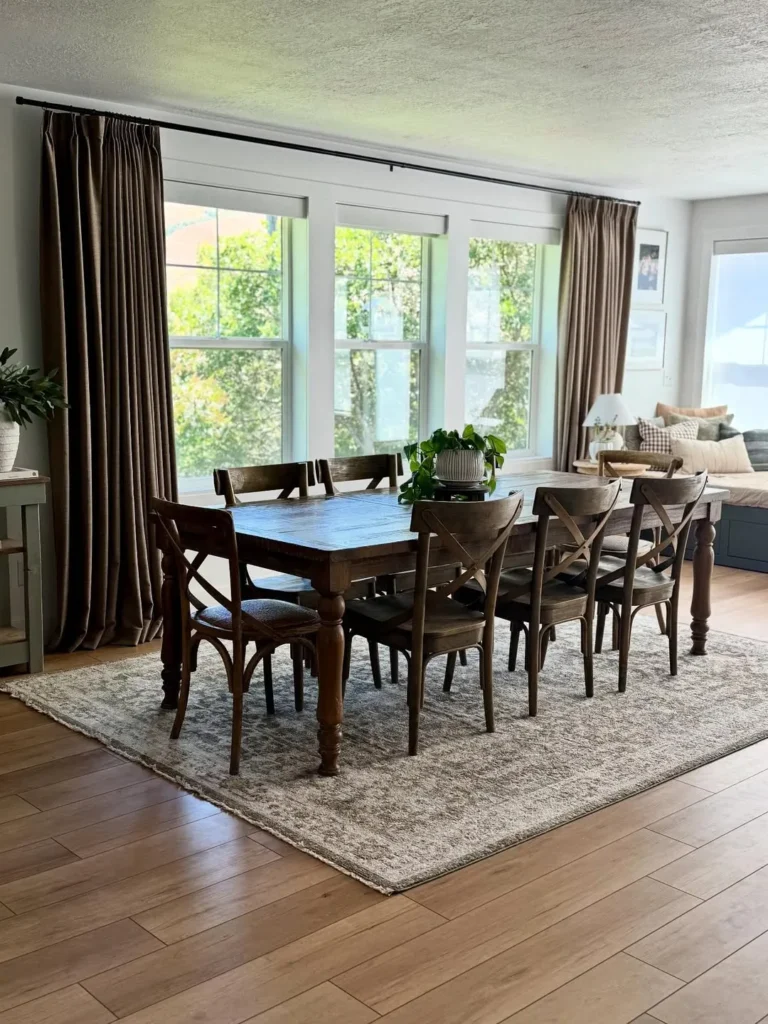 Dark Wood Dining Room by Large Windows