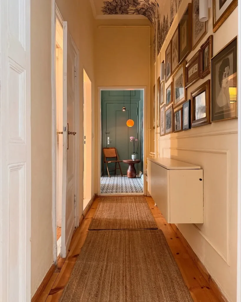 Gallery Wall Hallway with Warm Wood Floors