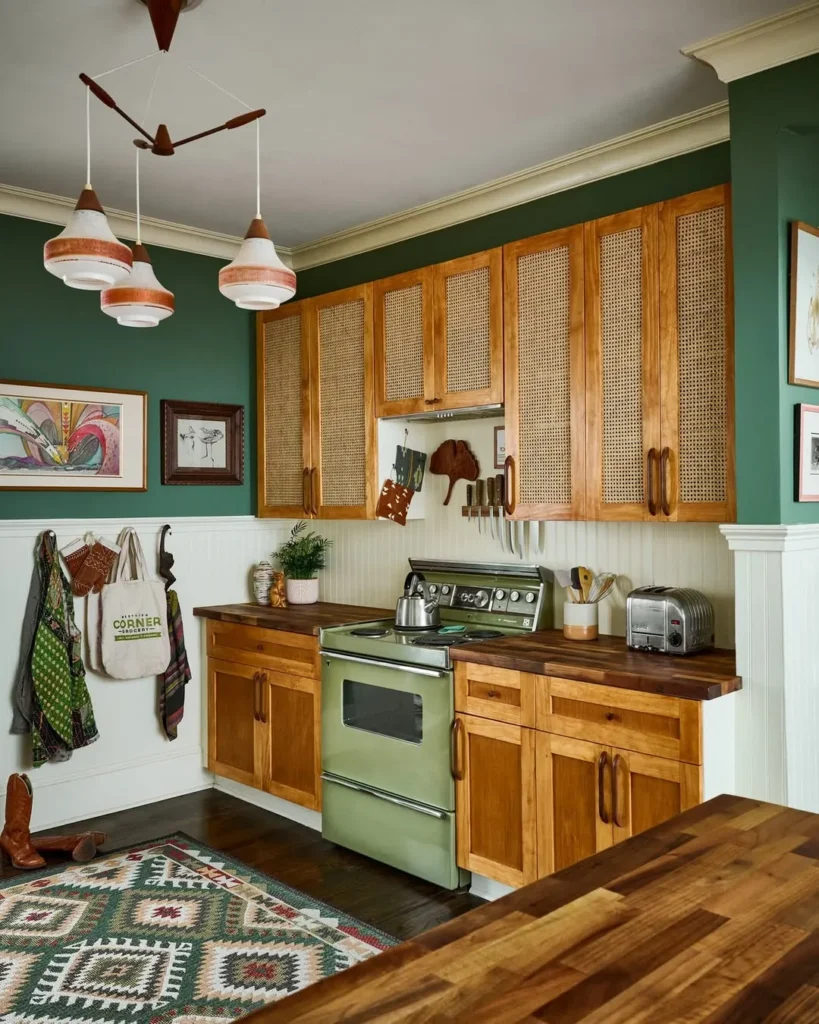 Green Kitchen with Cane Cabinets and Wood Counters