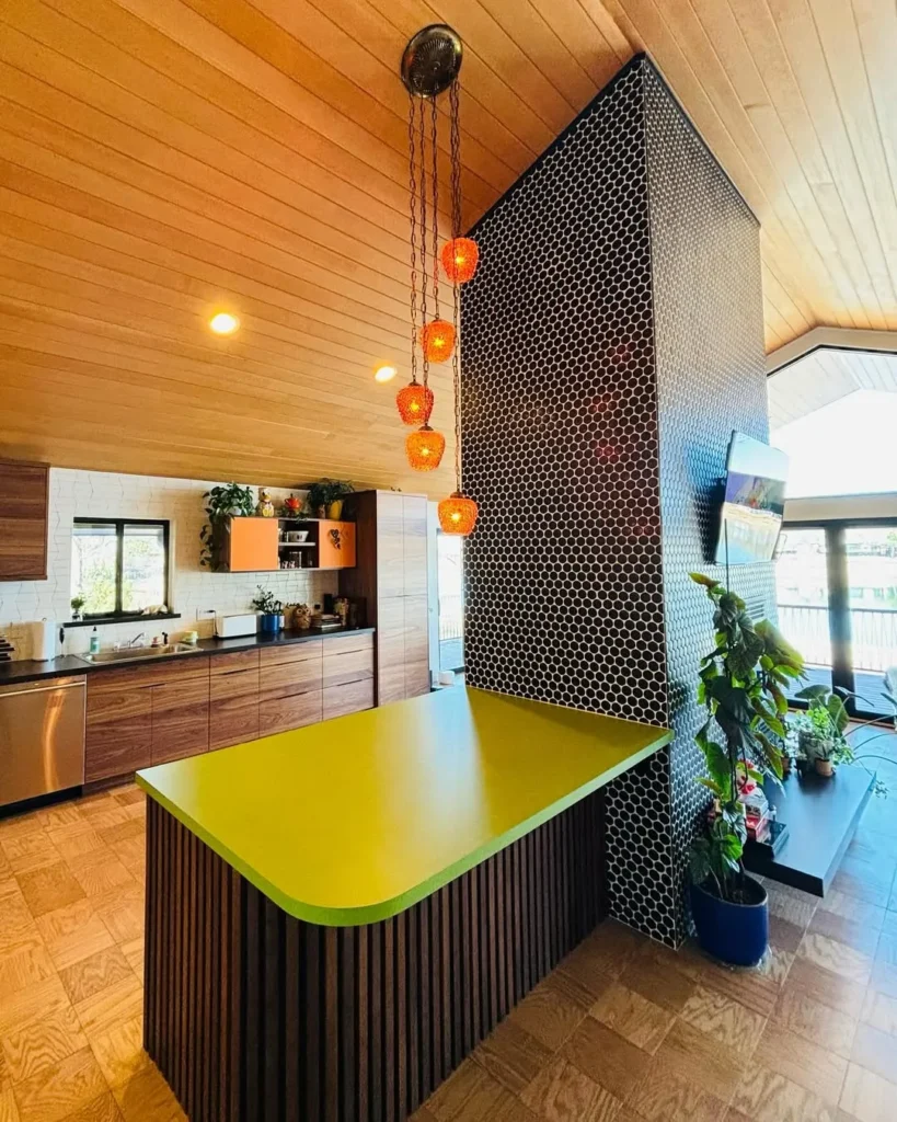 Kitchen with Lime Green Peninsula and Black Tile Column