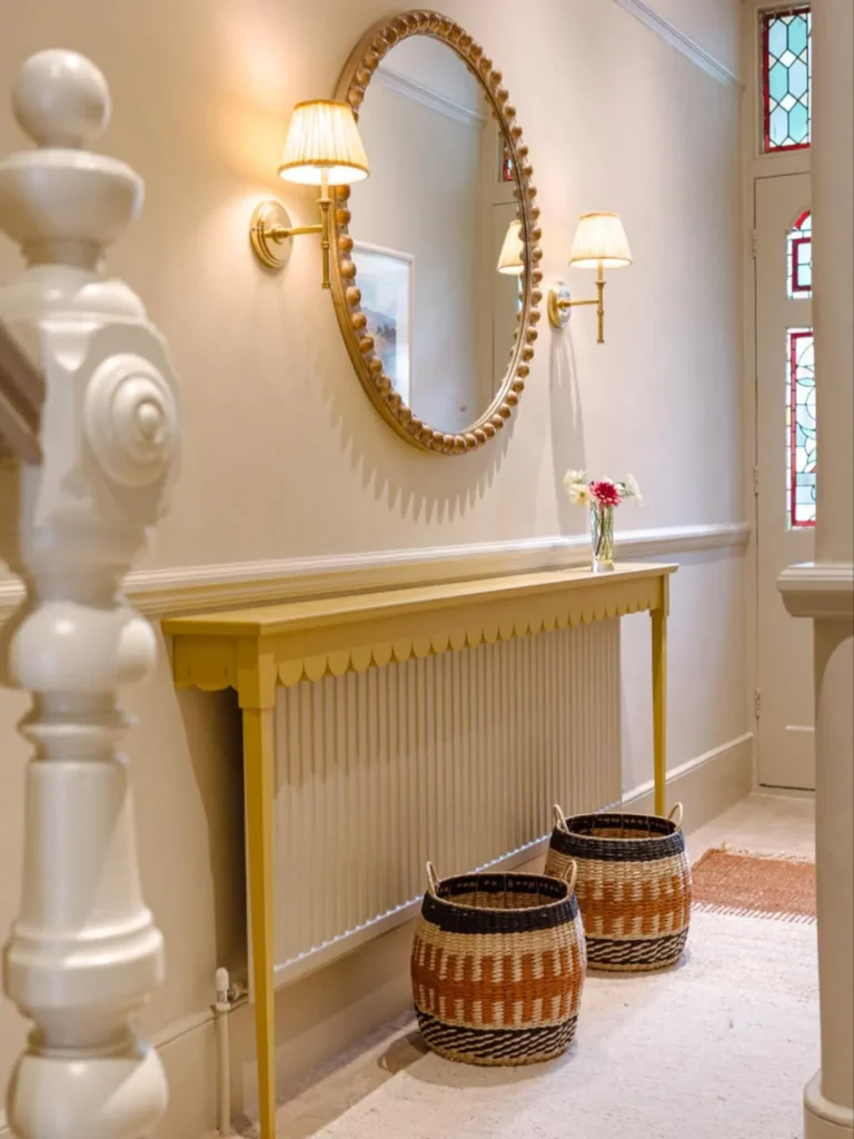 Narrow Hall with Round Mirror and Wall Lights