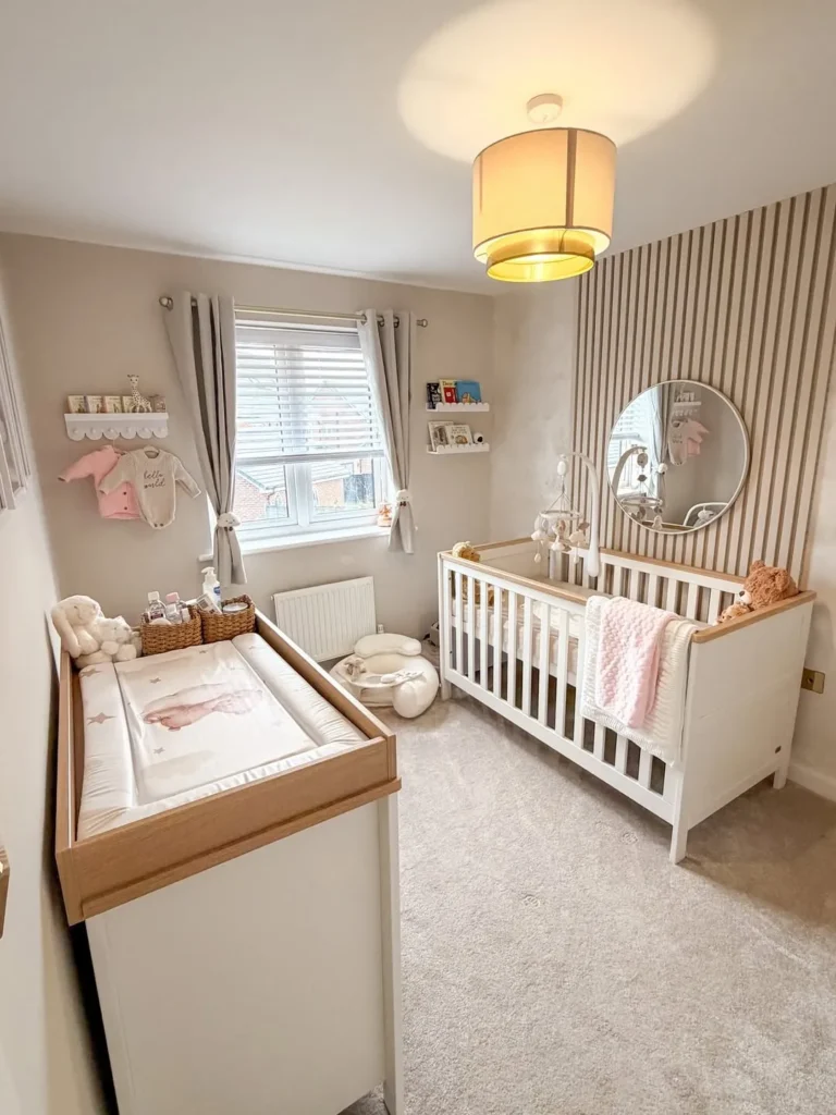 Neutral Pink Nursery with Wood Slat Wall