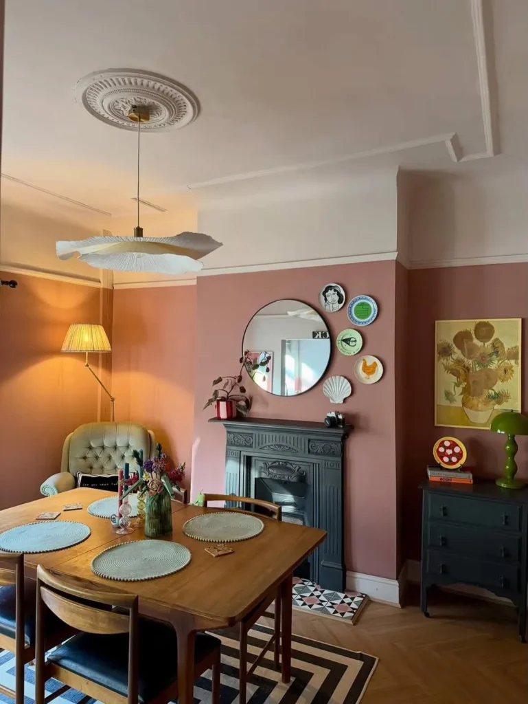 Pink Dining Room With Eclectic Wall Decor