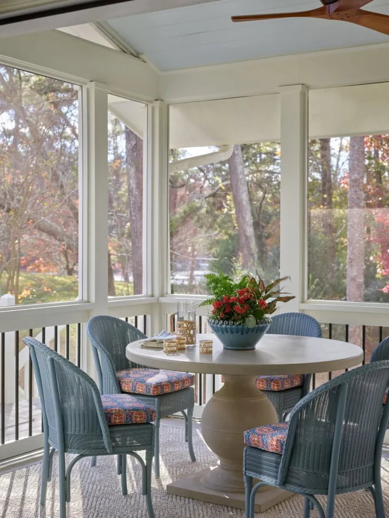Round Dining Table Porch with Blue Wicker Chairs