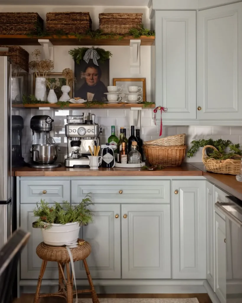 Sage Green Cabinets with Warm Wood Shelves