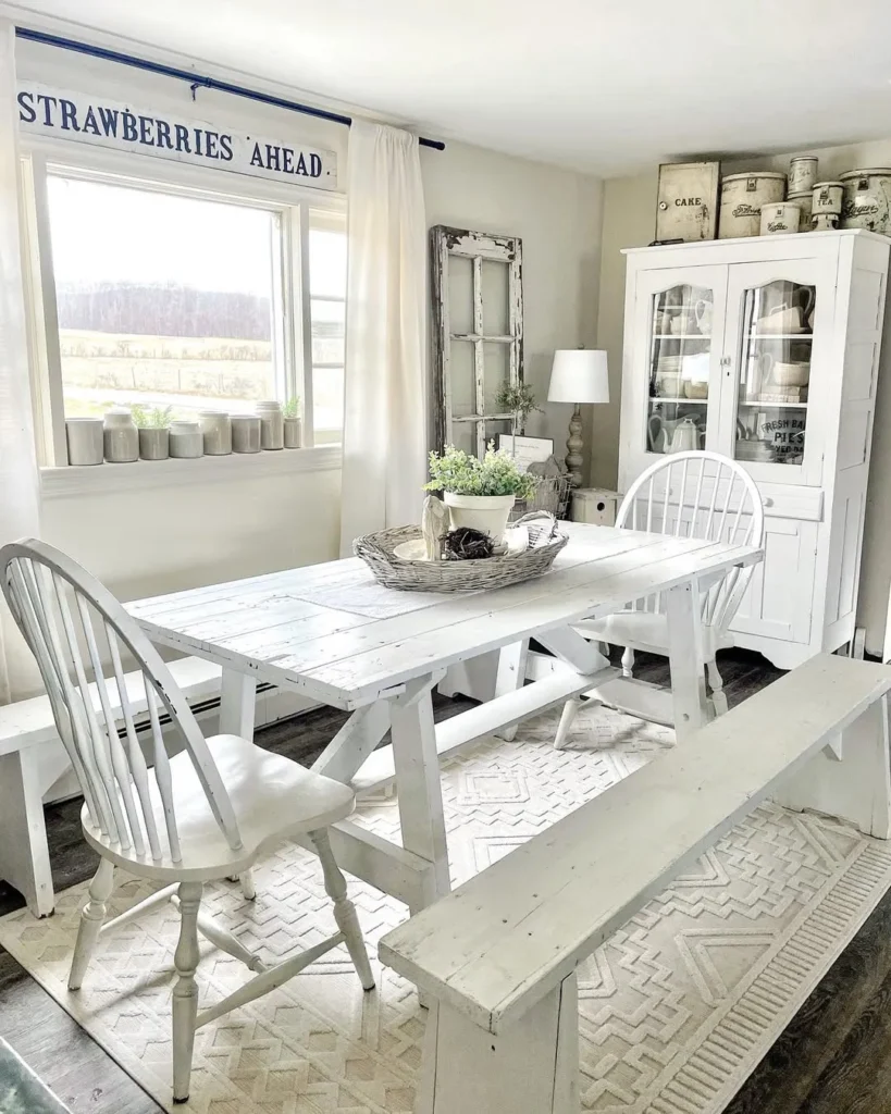 White Farmhouse Dining Room with Distressed Table
