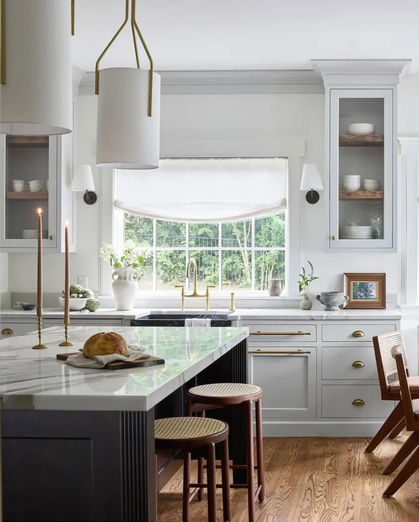 White Kitchen with a Two-Tone Island and Banquette Bench