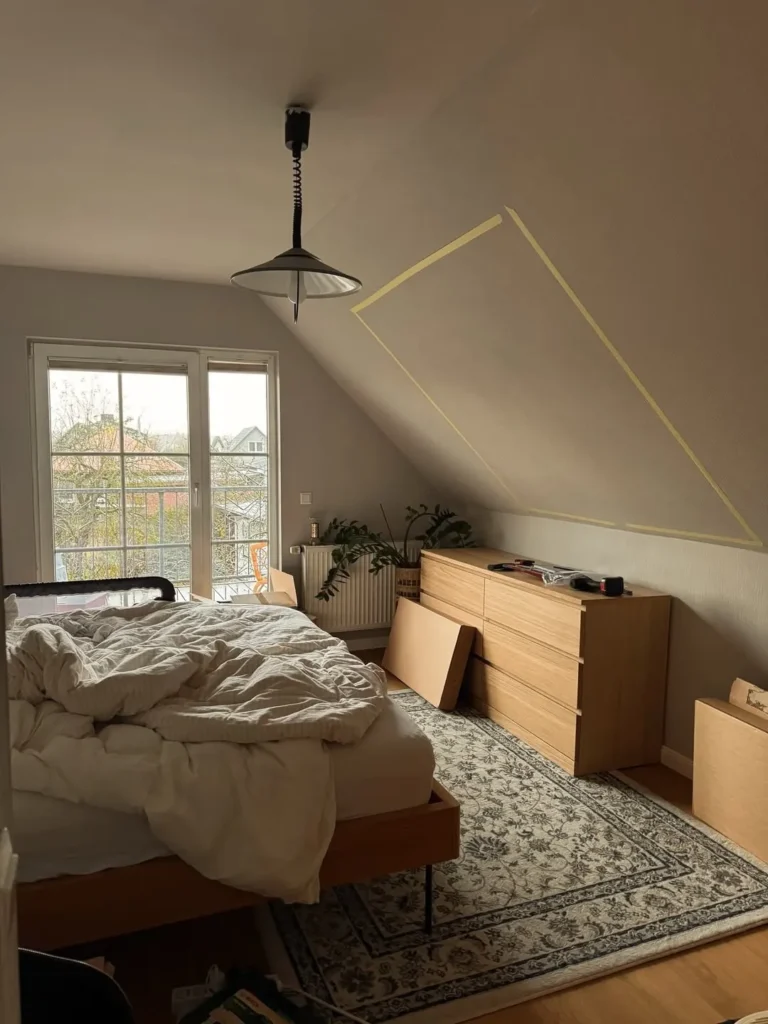 Attic Bedroom With Warm Wood and Neutral Tones