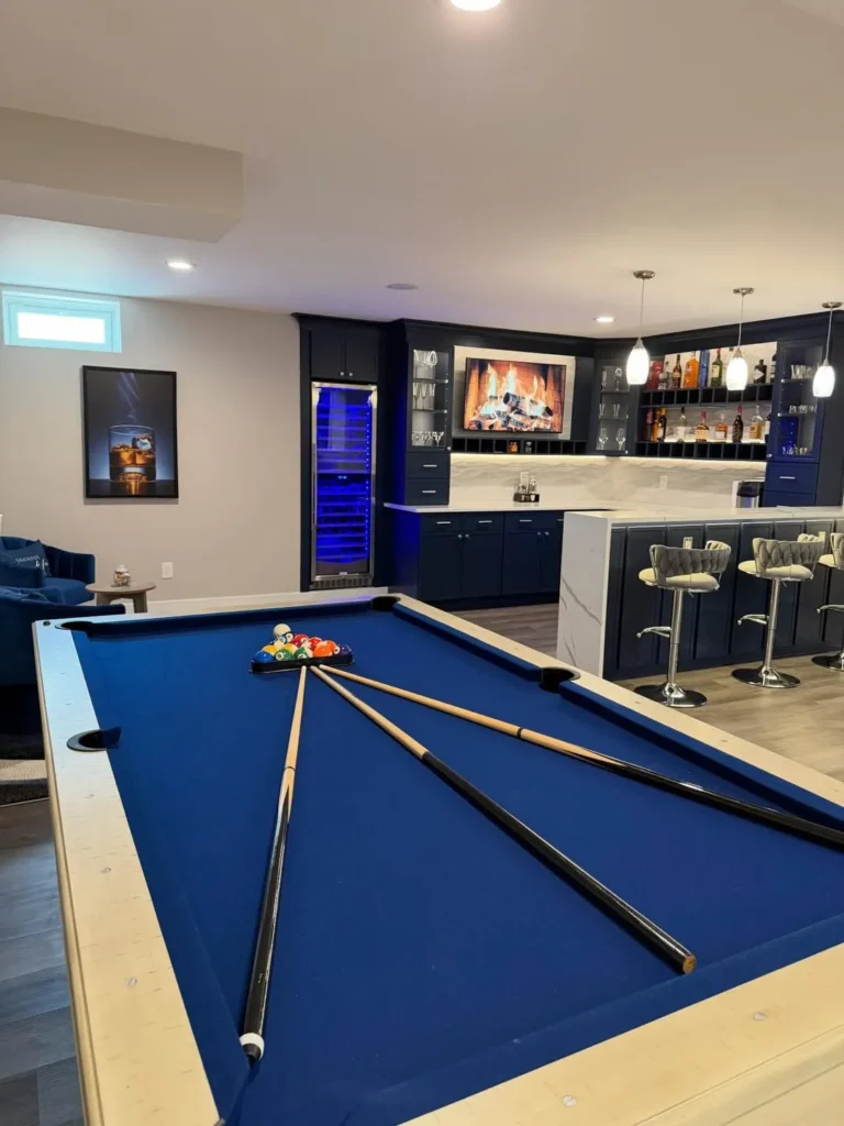 Basement Wet Bar With White Cabinets and Black Accents