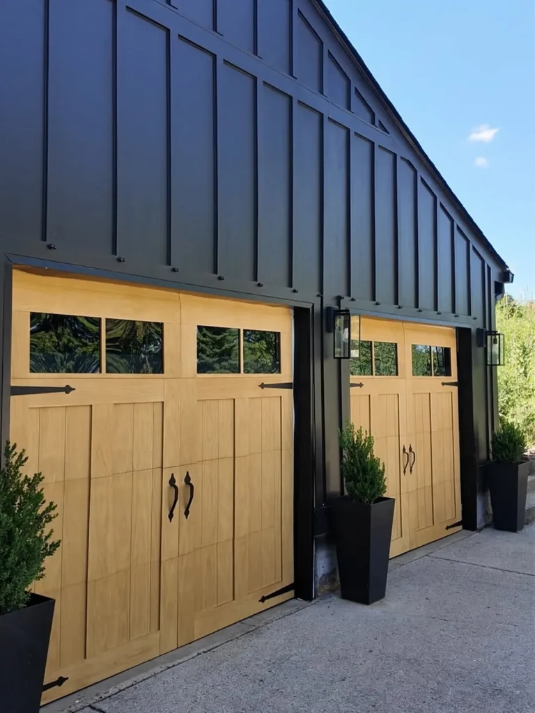 Black Barn Garage Doors With Natural Wood Contrast
