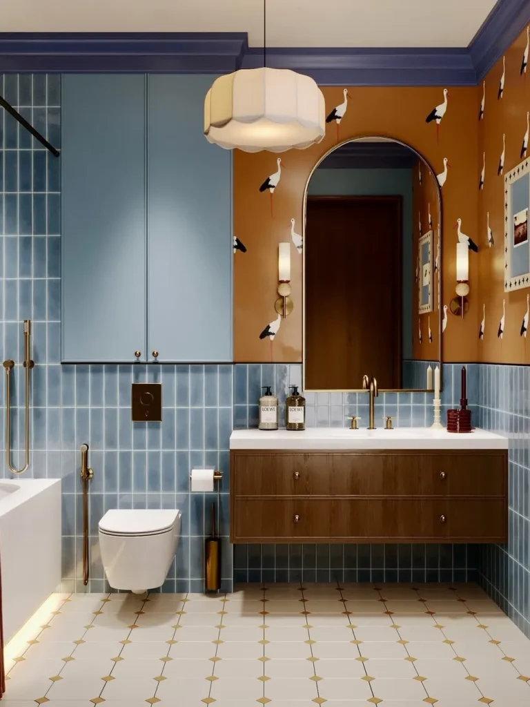 Blue Tile Bathroom With Bold Wallpaper Accents