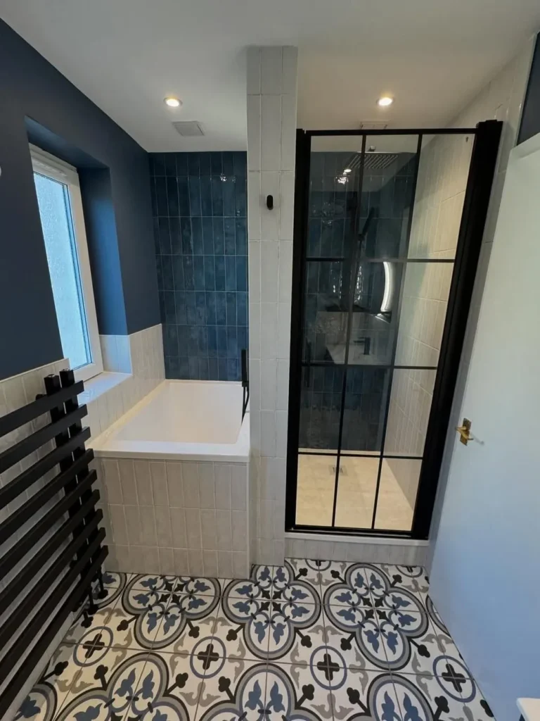 Blue and White Bathroom With Black Grid Shower