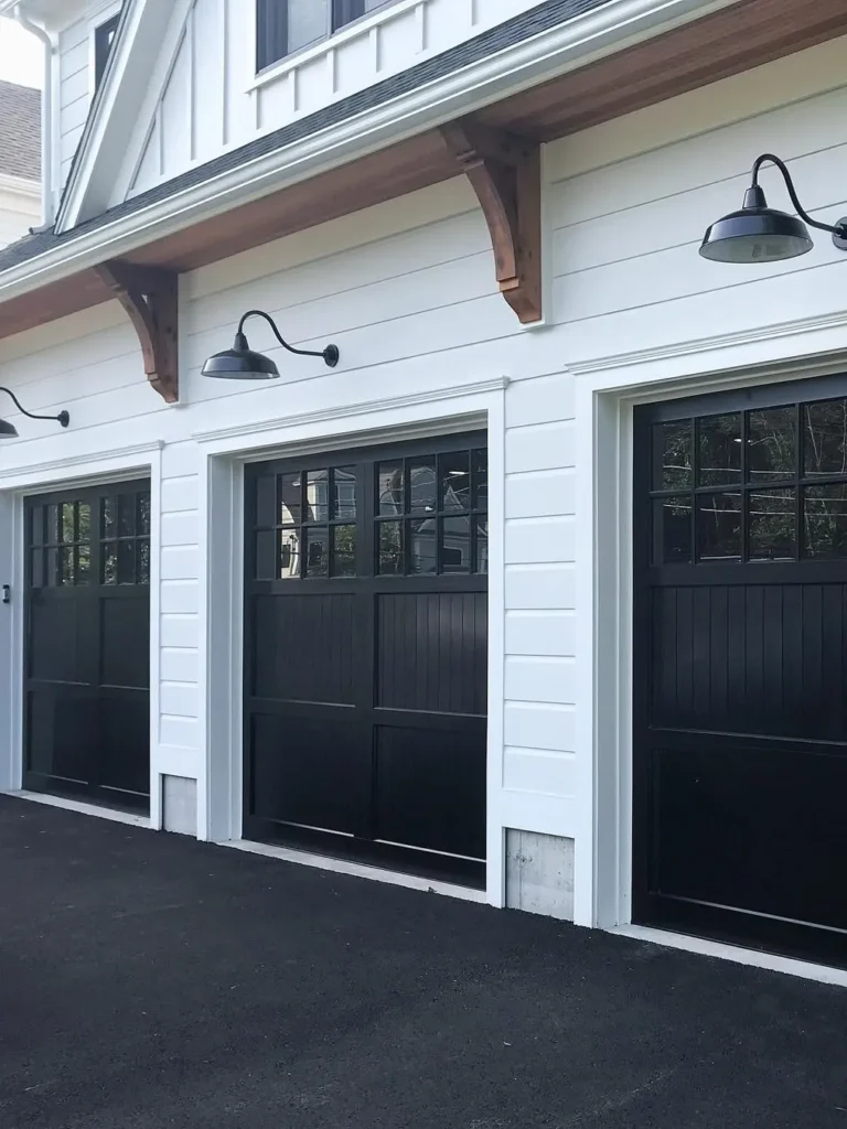 Classic Black Garage Doors With Carriage House Details
