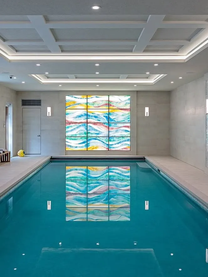 Classic Indoor Pool Design With Statement Wall Art