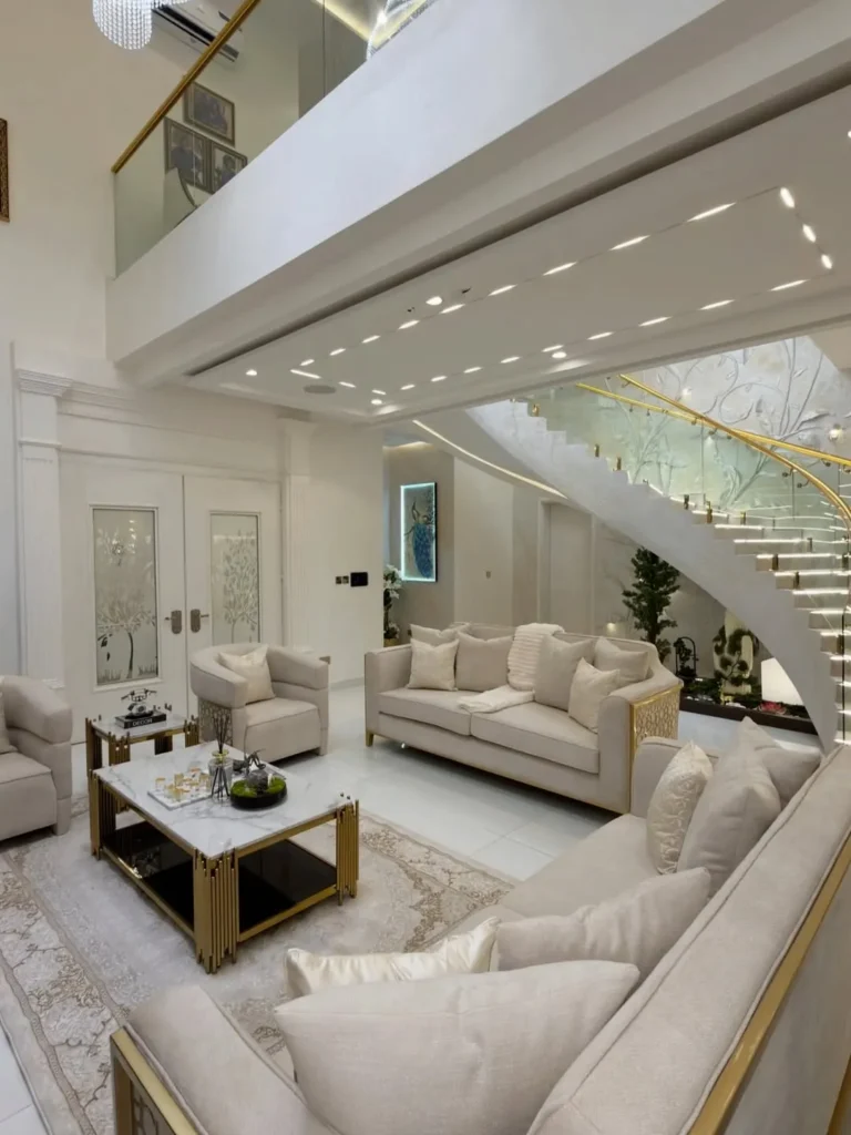 Double Height Living Room With Curved Staircase