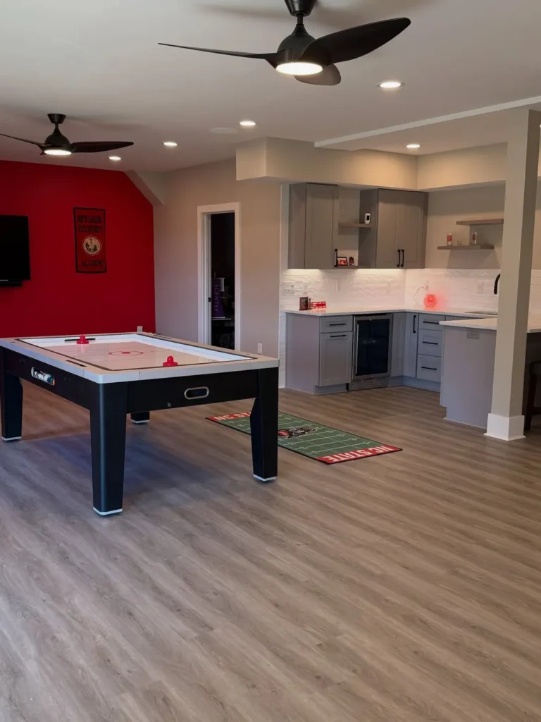 Finished Basement Dining Area With Black Cabinetry