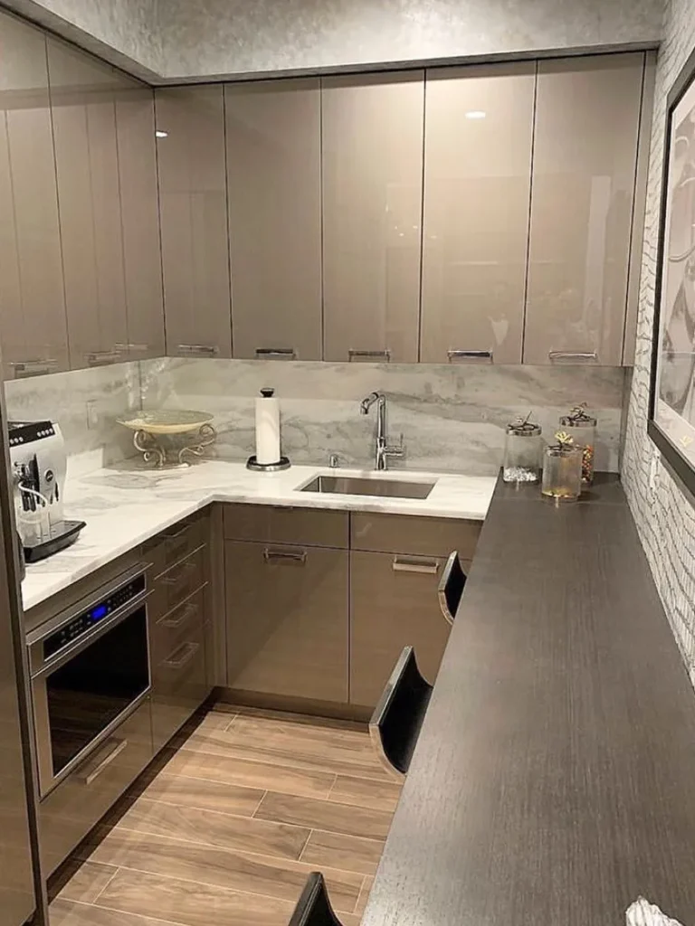 Glossy Taupe Cabinetry for a Modern Basement Kitchenette