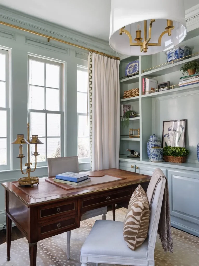 Light Blue Home Office Setup With Built-In Shelves