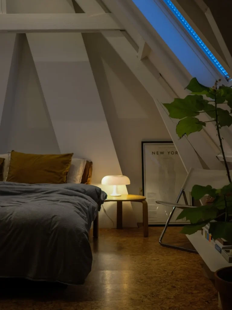 Modern Attic Bedroom With Exposed Beams and Soft Lighting