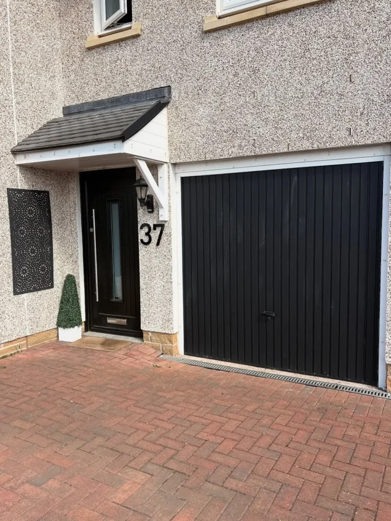 Modern Black Vertical Panel Garage Door