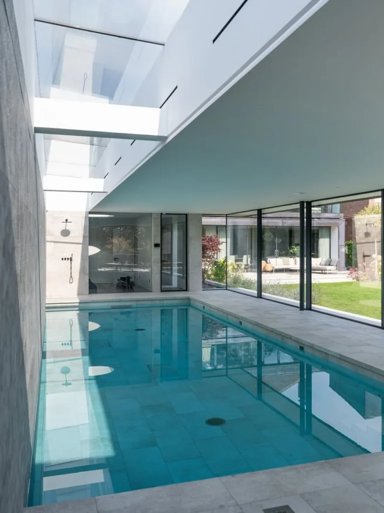 Modern Indoor Pool With Floor-to-Ceiling Glass Walls