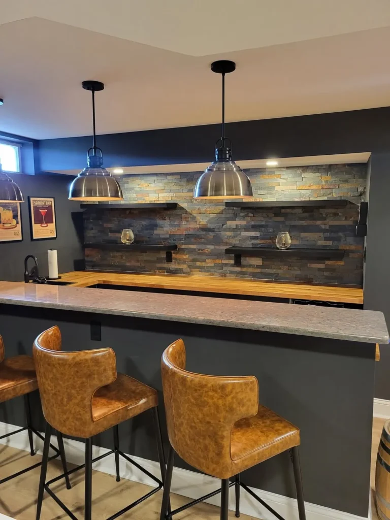 Moody Basement Bar With Stone Accent Wall