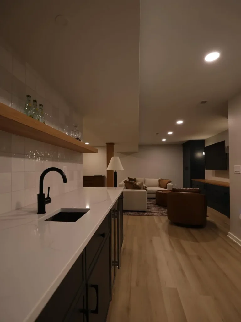 Moody Basement Wet Bar With Cozy Lounge Area