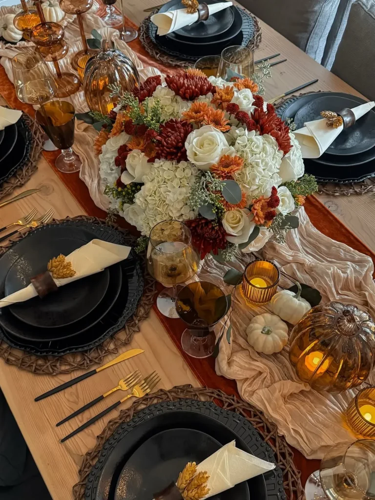 Moody Fall Table Decor With Black Dinnerware and Amber Glass