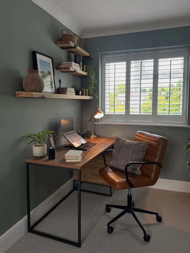 Moody Green Workspace With Rustic Wood Shelves