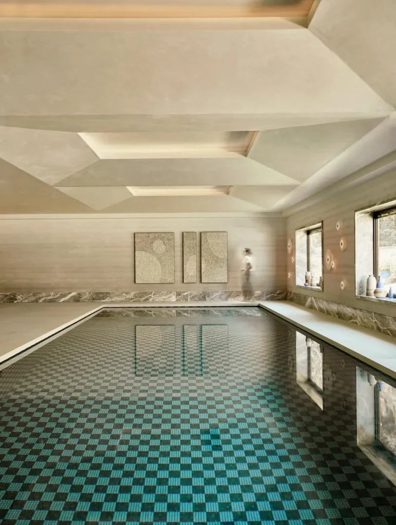 Neutral Indoor Pool Design With Checker Tile Floor