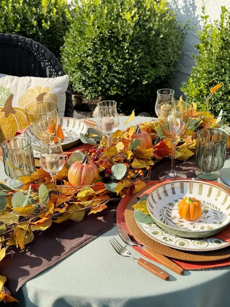 Outdoor Fall Tablescape With Leaf Garland and Mini Pumpkins