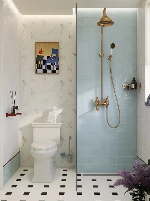 Soft Blue Bathroom With Brass Shower Fixtures