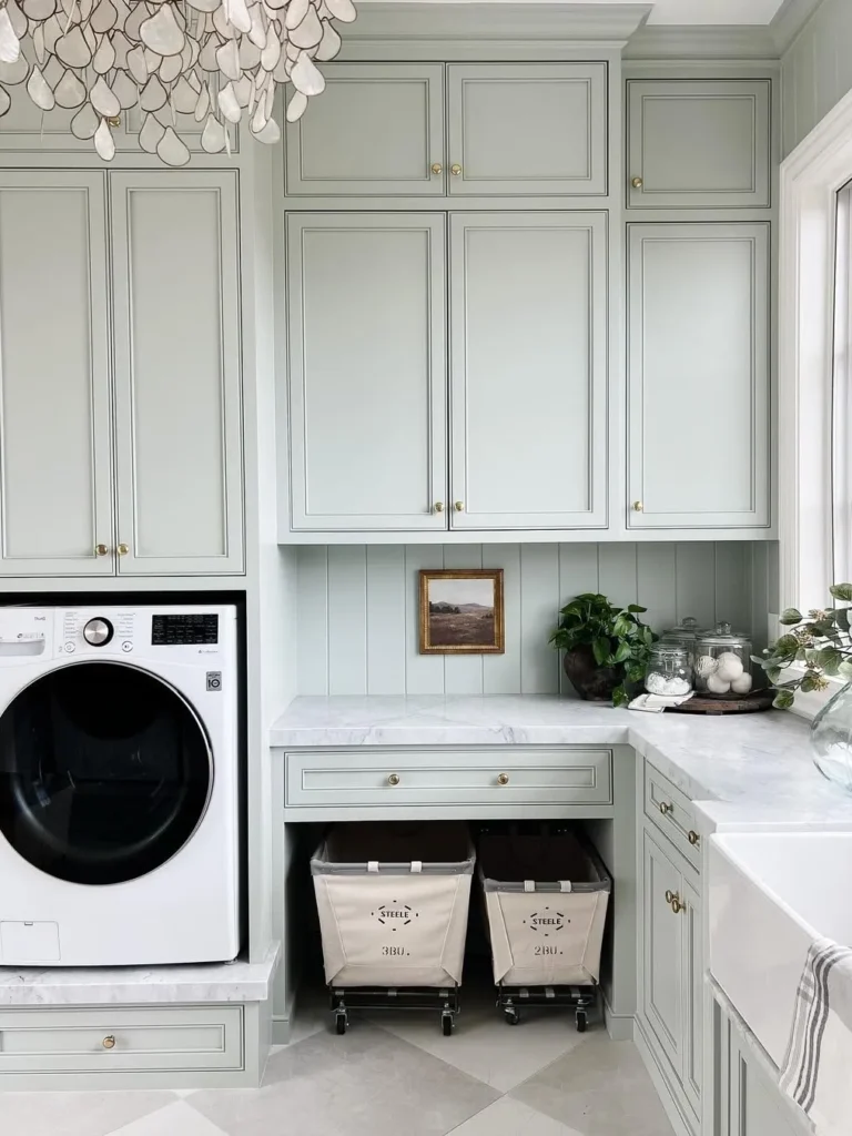 Soft Sage Laundry Room With Floor-to-Ceiling Cabinets