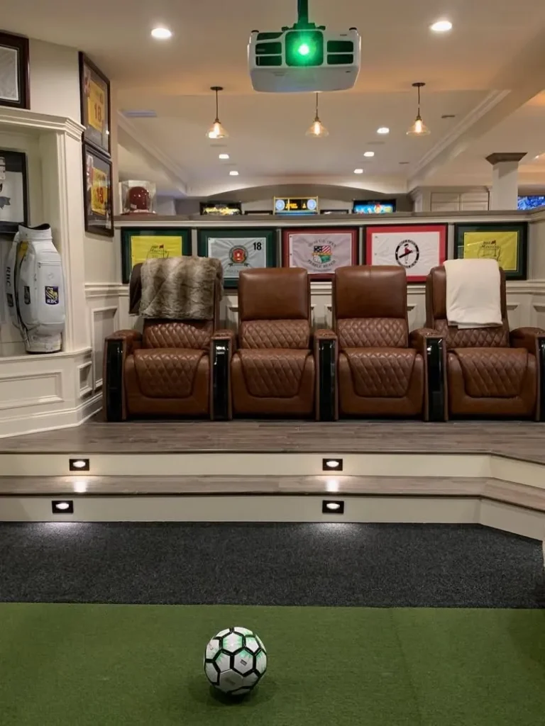 Sports-Themed Basement Theater With Recliner Seating