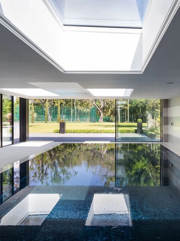 Sunlit Indoor Pool With Garden Views