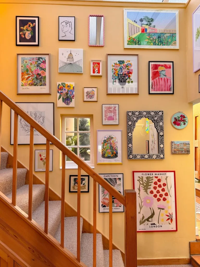Colorful Staircase Gallery Wall With Eclectic Prints