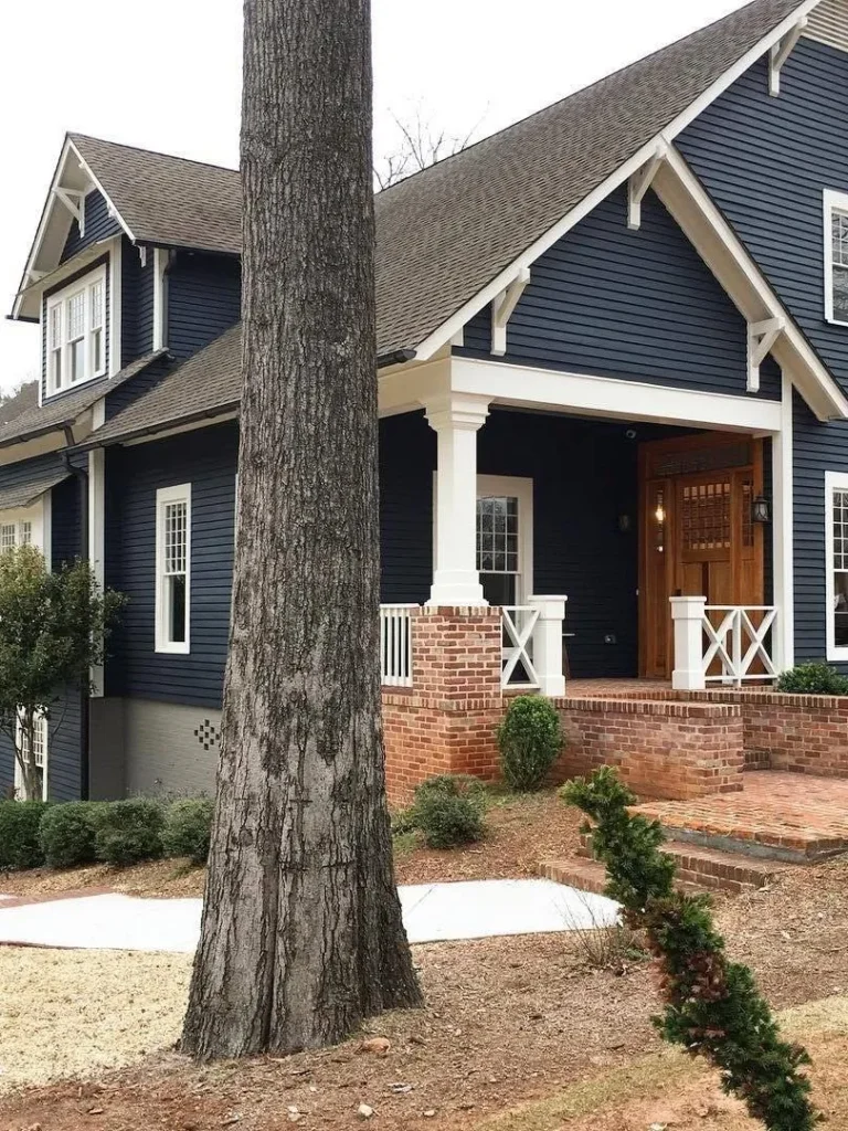 Craftsman Exterior in Dark Blue and Brick Accents